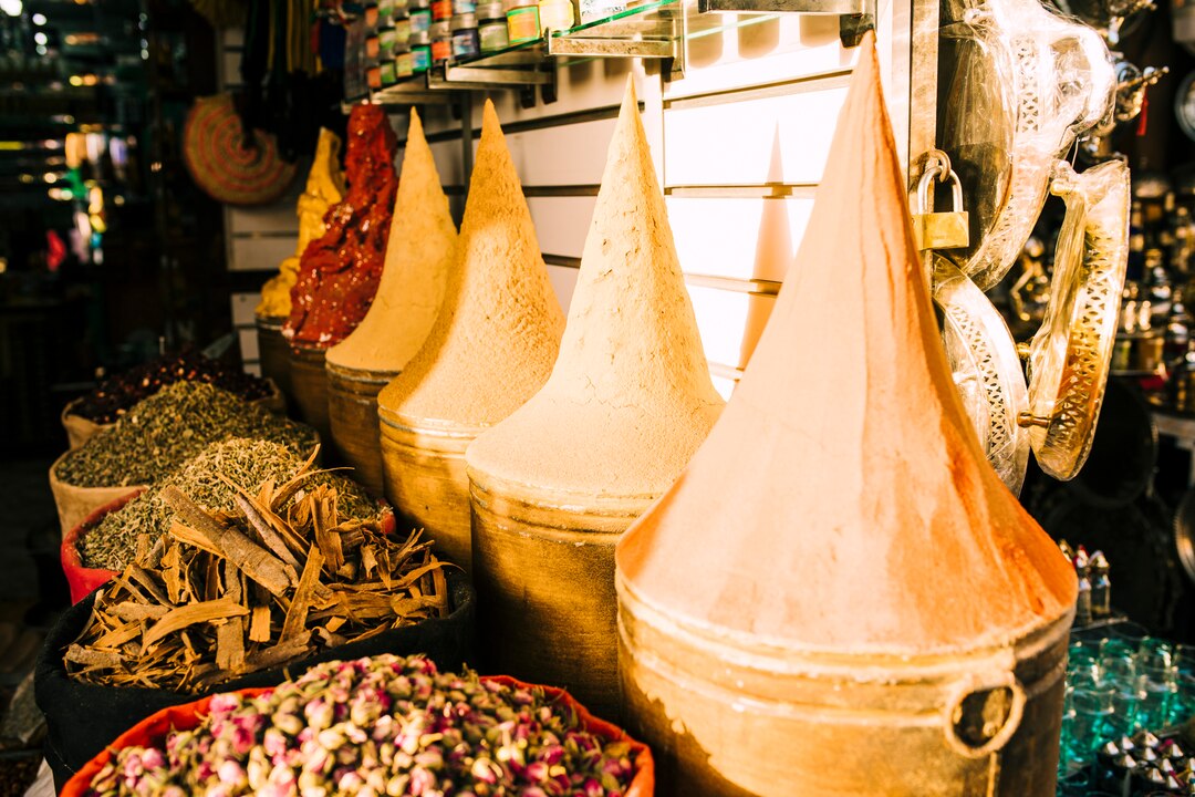 Traditional Omani spices and ingredients in a colorful souk market