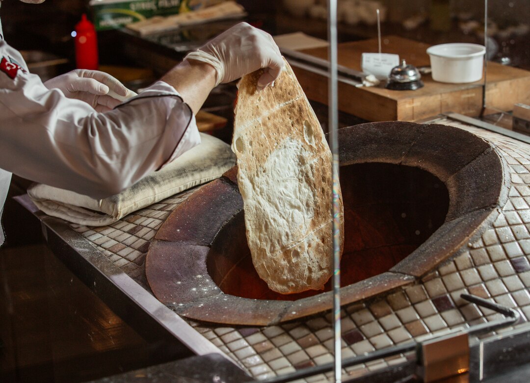Traditional Omani Shuwa being prepared in underground oven